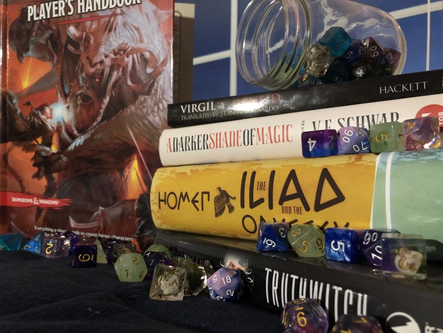 Image of four books stacked on each other with dungeons and dragons in the background